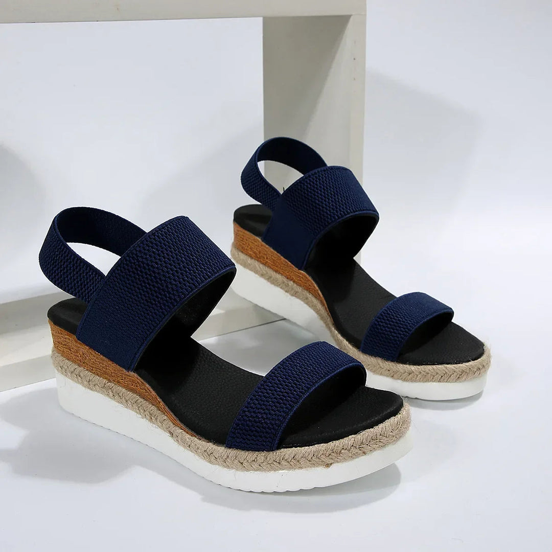 Comfortable women's slip-on open-toe flat sandals, great for everyday casual wear & summer comfort.