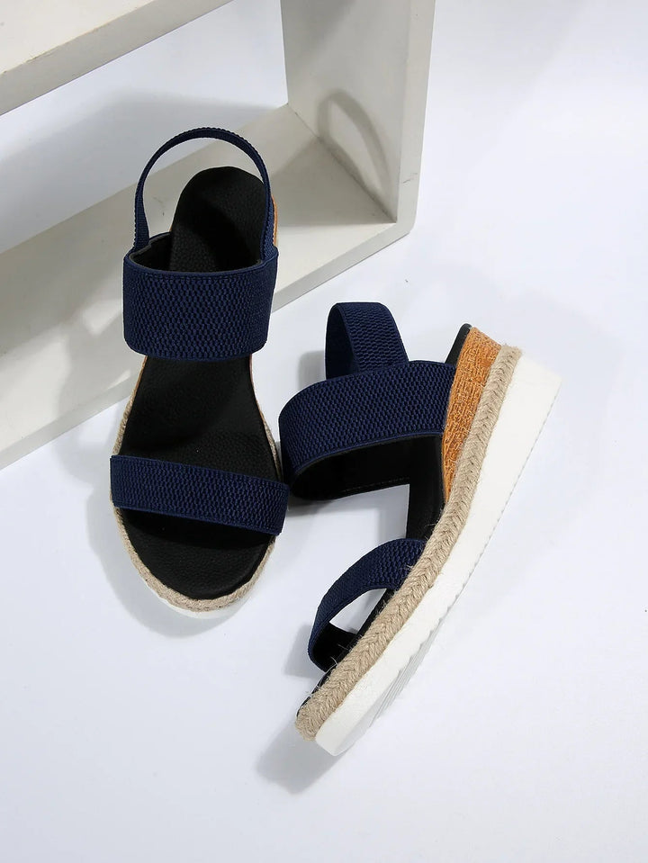 Blue women's comfortable slip-on flat sandals, perfect everyday casual summer footwear with an open toe.