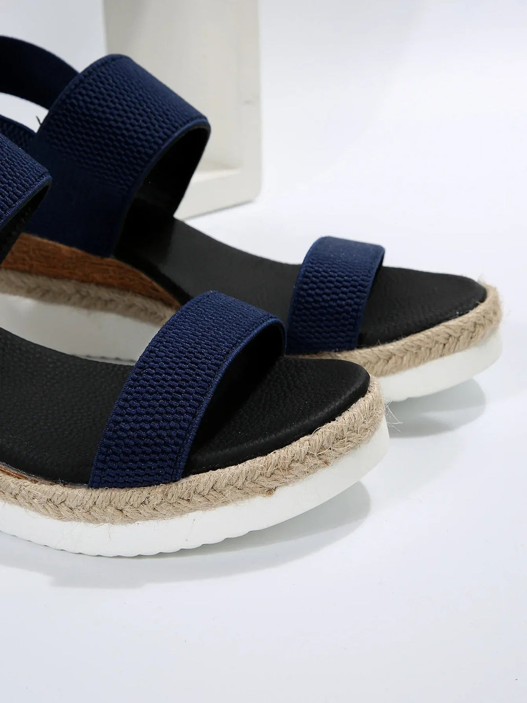 Casual women's slip-on sandals for easy everyday wear. Comfortable flat summer footwear with an open toe.
