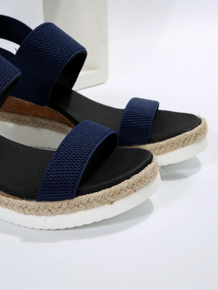 Casual women's slip-on sandals for easy everyday wear. Comfortable flat summer footwear with an open toe.