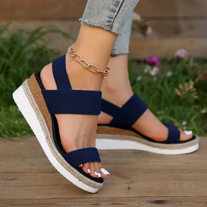 Everyday women's comfortable slip-on flat sandals. Open-toe summer footwear, versatile for casual wear.