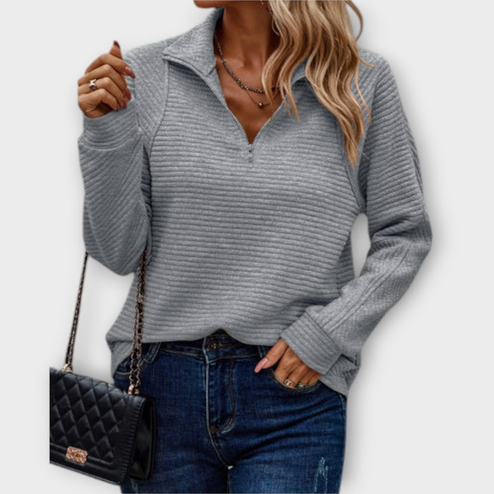 Fashionable women's V-neck long sleeve jumper, a comfortable knit pullover for everyday chic or layering.