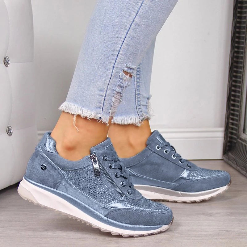 Ergonomic women's walking shoes, showcasing comfortable design and functional side zip feature.
