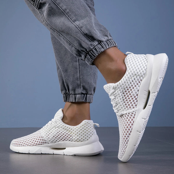 Black women's casual sneakers, perfect for travel & everyday wear, offering excellent arch support.