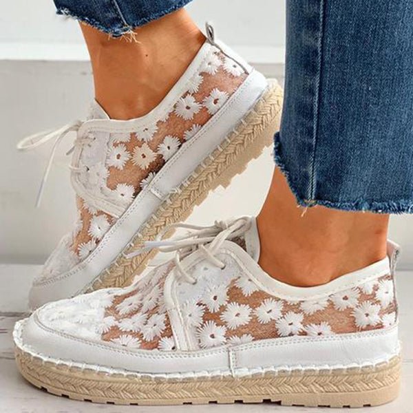 Versatile beige embroidered women's sneakers, offering comfort and casual everyday style for walking.