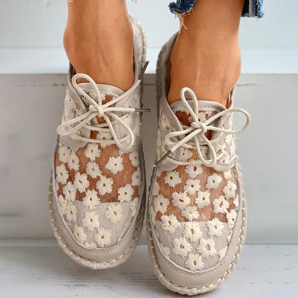 Chic women's white embroidered sneakers, combining ultimate comfort with stylish design for daily wear.