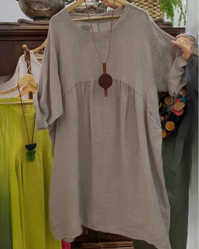 Flowy knee-length women's summer dress, comfortable wide fit, great for casual everyday fashion.
