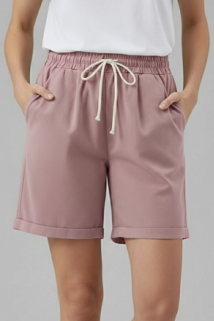 Lightweight women's summer shorts with drawstring and pockets, suitable for active wear.