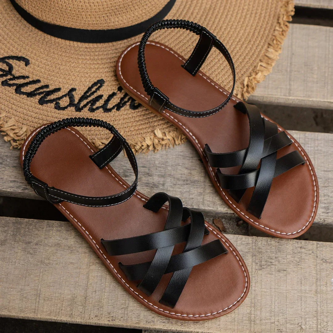 Comfortable women's summer sandals, easy slip-on style with crisscross detail and a secure elastic backband.