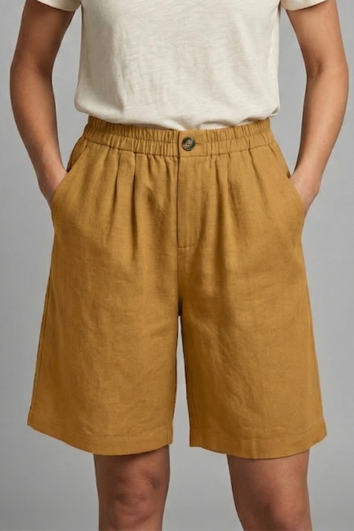 Women's fashion mid-length shorts with an elastic waist, drawstring, and convenient side pockets.