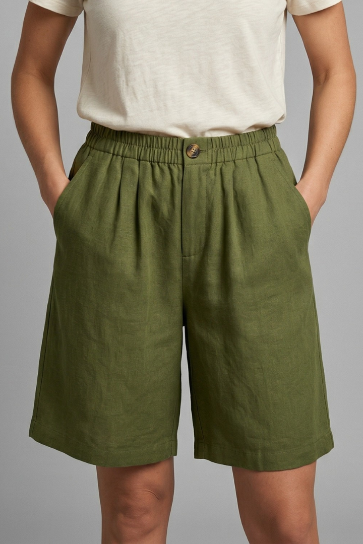 Mid-length women's shorts featuring a comfortable elastic waist & convenient pockets for activewear.