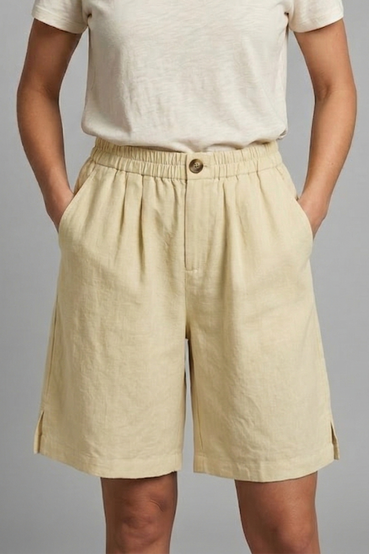 Casual mid-length women's shorts, elastic waist, drawstring, and pockets; perfect for summer comfort.