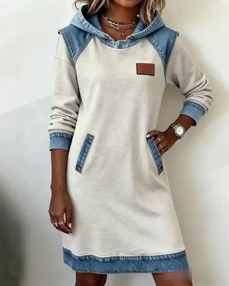 Chic women's hooded casual dress for urban look. Modern streetwear with comfortable, relaxed fit.