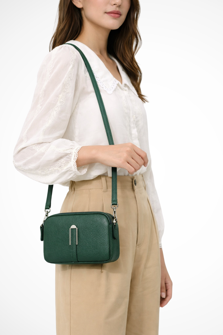 Fashionable small crossbody bag for women, featuring a practical double zip design.