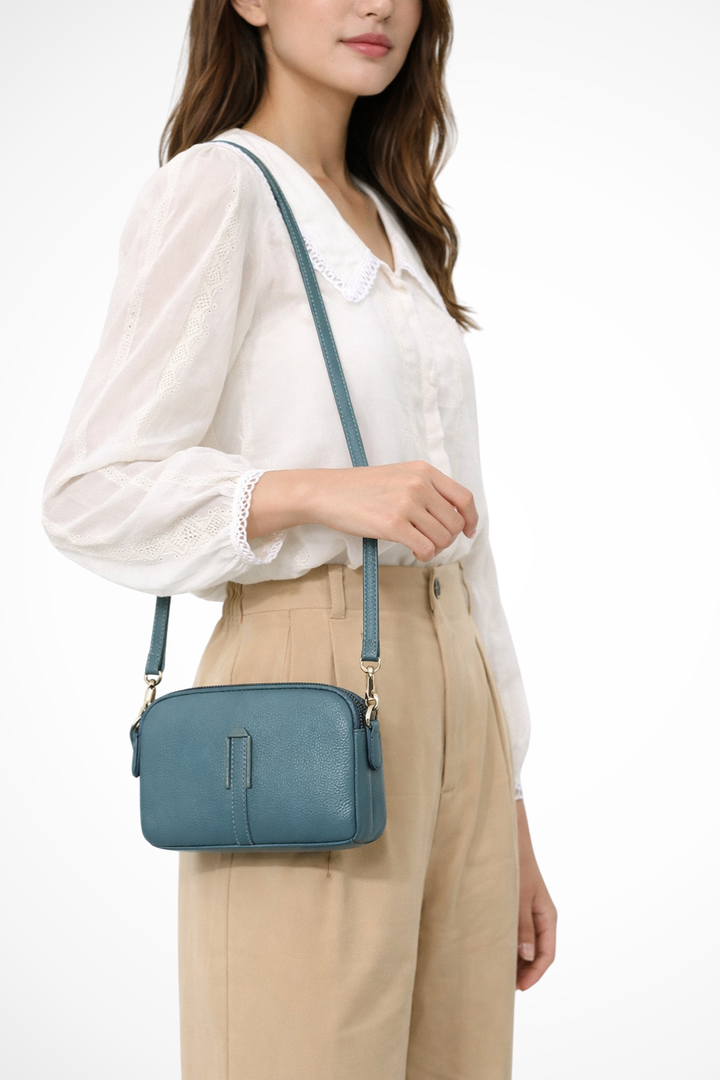 Textured women's compact double zip shoulder bag, an essential small fashion accessory.