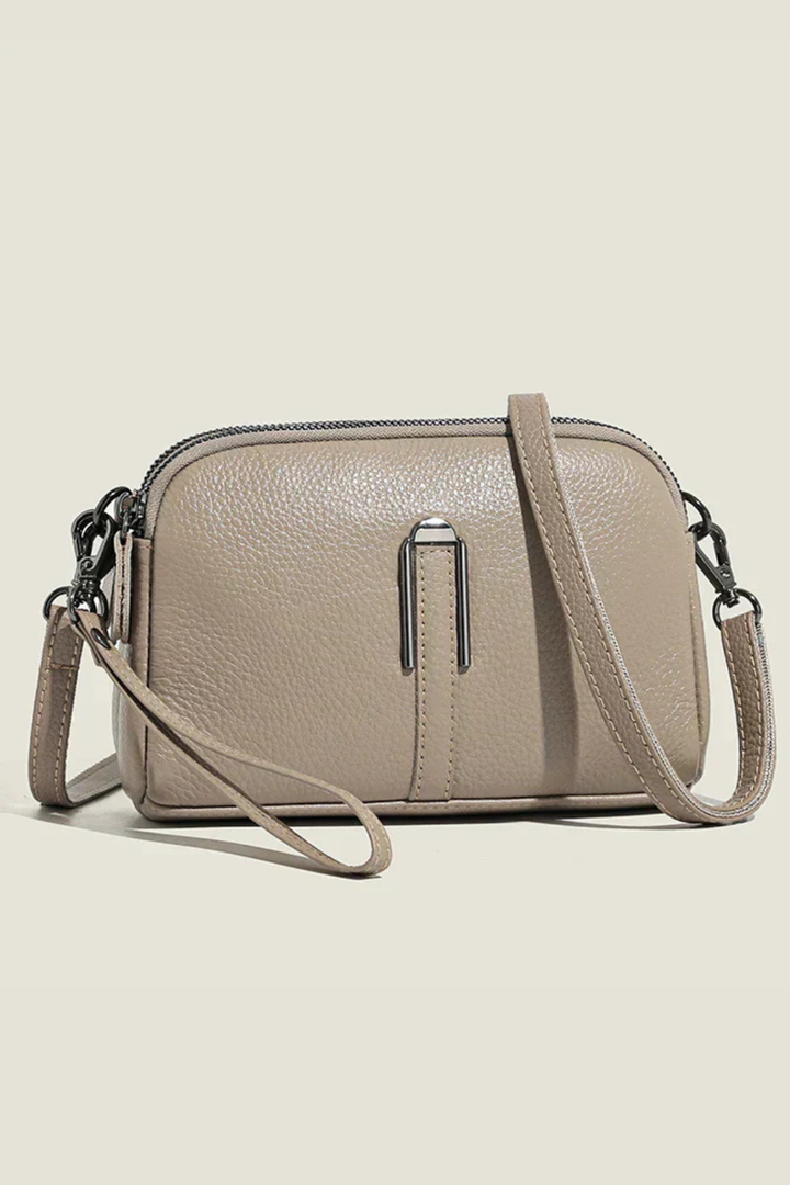 Modern women's small double zip crossbody bag, a stylish & organized everyday accessory.