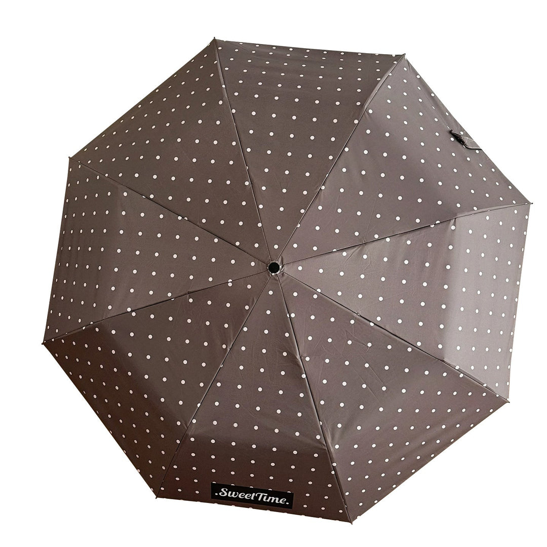 Polka dot compact umbrella, women's portable rain gear, ideal for all-weather conditions.