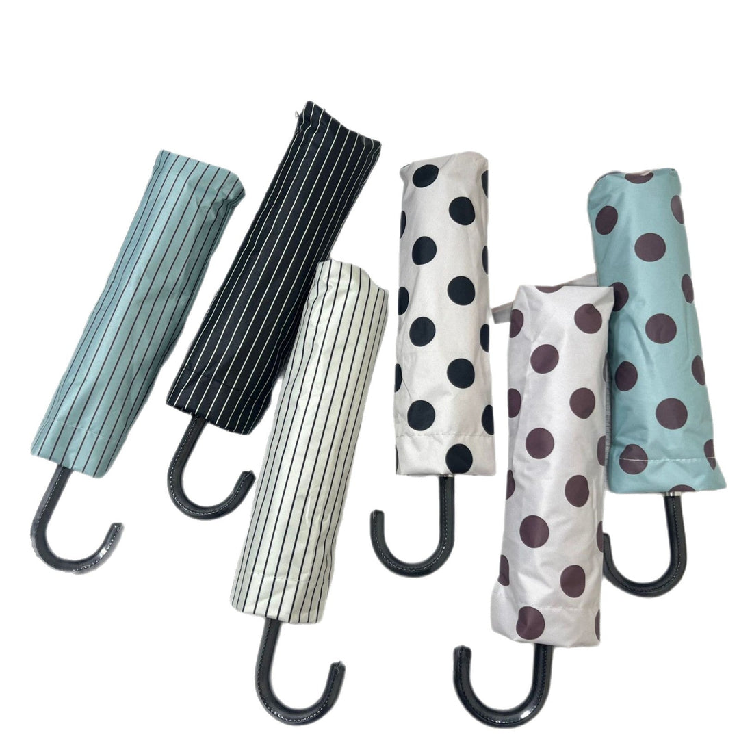Mini folding umbrella for women, stylish polka dot, excellent for travel and sudden showers.