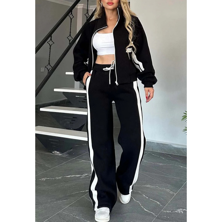 Casual women's lounge set featuring a zip-up top & wide-leg pants. Ideal comfortable outfit for relaxing.