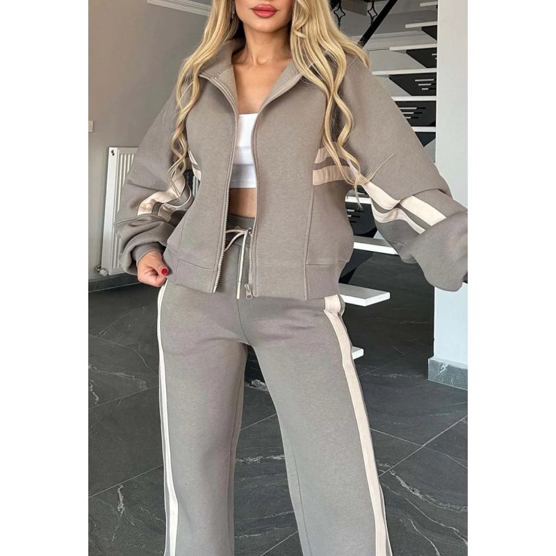 Detailed view of the contrast stripe design on the women's zip-up lounge tracksuit set. Casual & activewear.