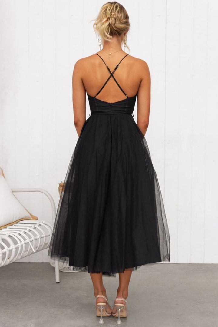 Romantic women's midi dress featuring a structured corset bodice and flowing tulle skirt for evenings.