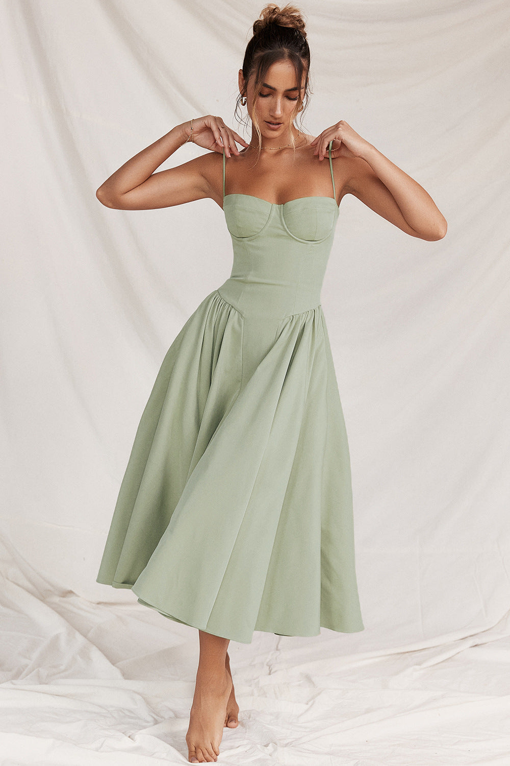 Elegant bodycon midi dress for women, featuring a stylish corset top and adjustable straps.