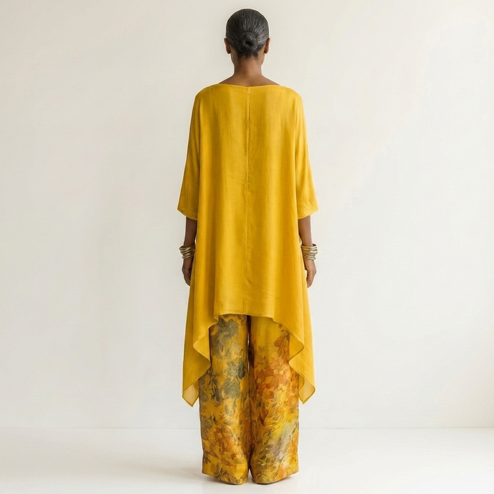 Women's elegant cotton-silk two-piece set, an asymmetric tunic and relaxed pants for summer fashion.