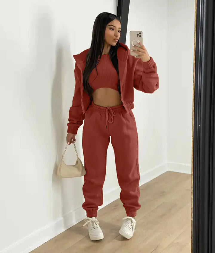 Relaxed fit women's 3-piece outfit, featuring a cozy hoodie, supportive bralette, and jogger pants.