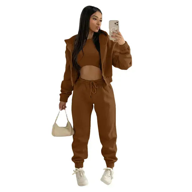 Women's casual matching set: soft hoodie, bralette, and joggers for a chic, comfy look.