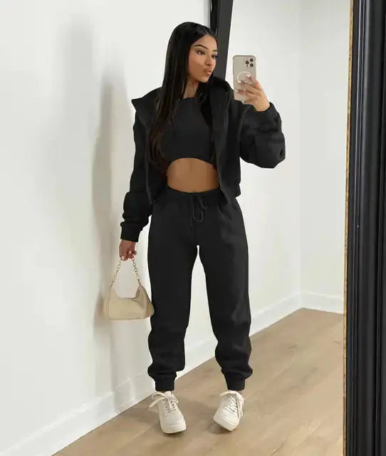 Casual women's loungewear set in a comfortable knit. Includes hoodie, bralette, and joggers for daily wear.