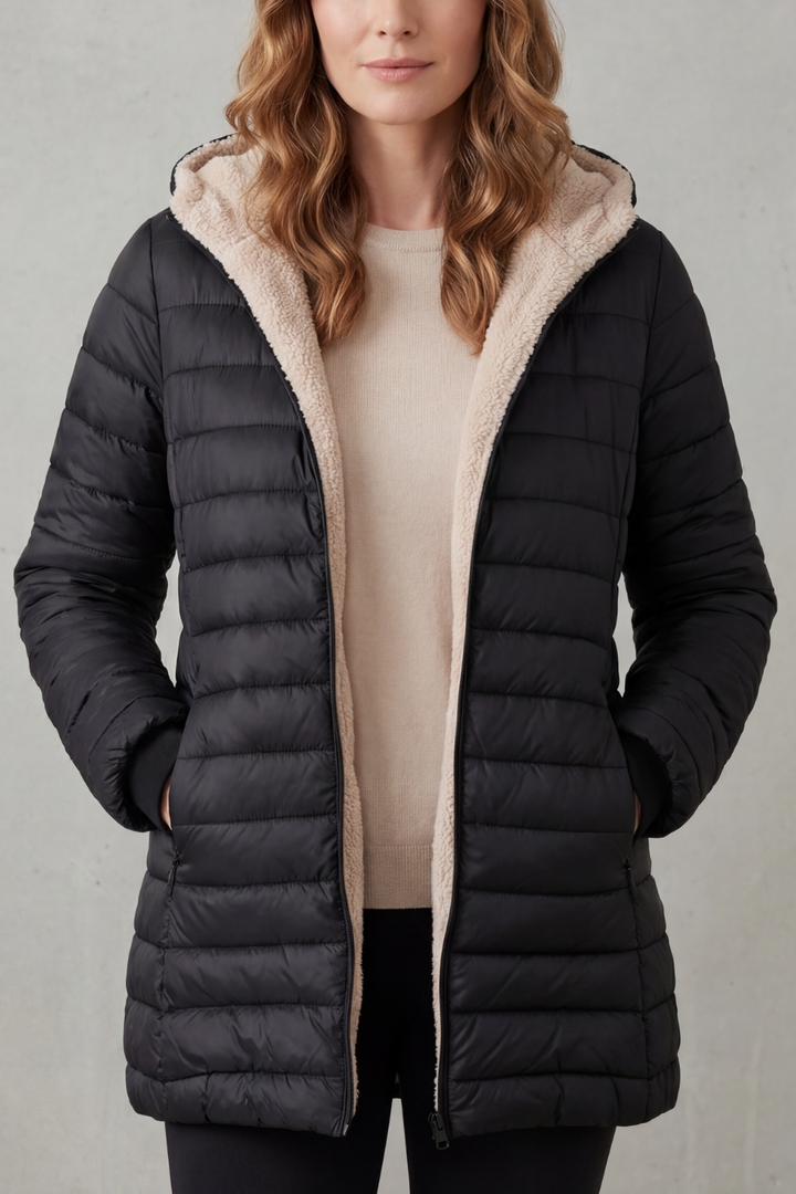 Women's cozy black hooded winter jacket, warm outerwear for cold weather.
