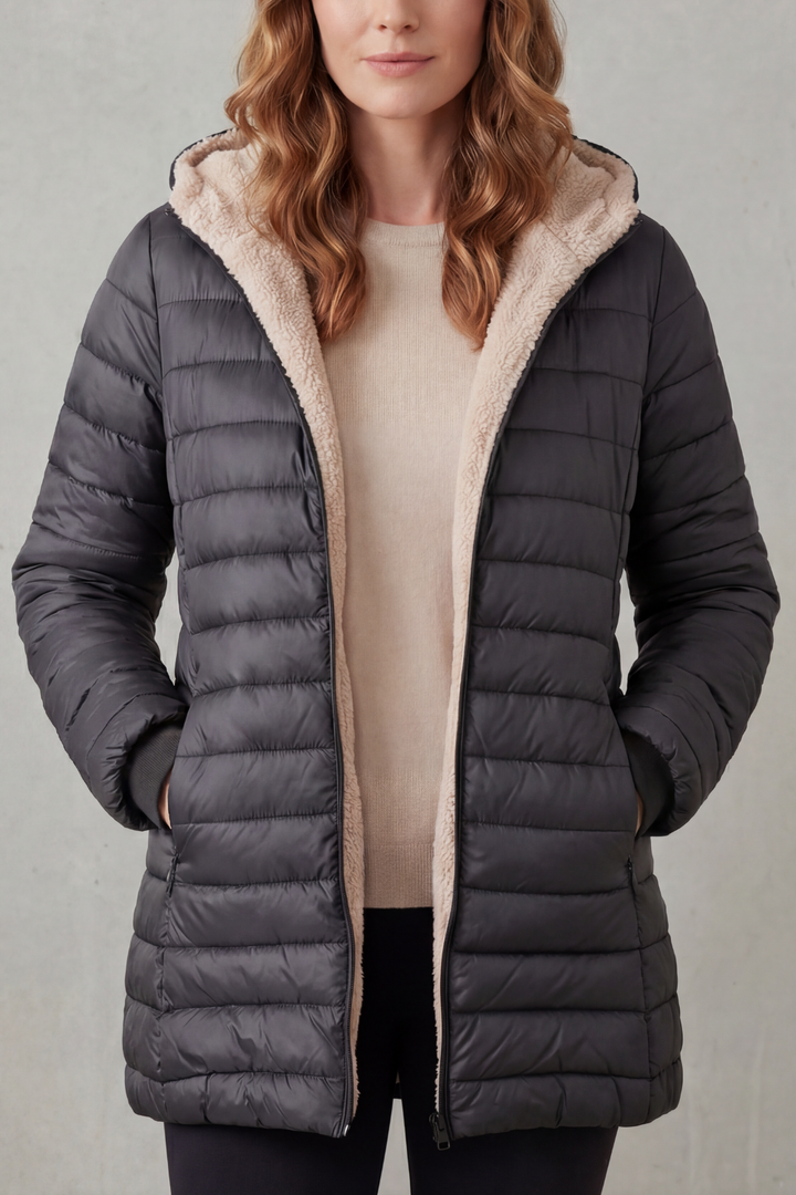 Cozy women's hooded jacket for winter, providing essential warmth & protection from cold.
