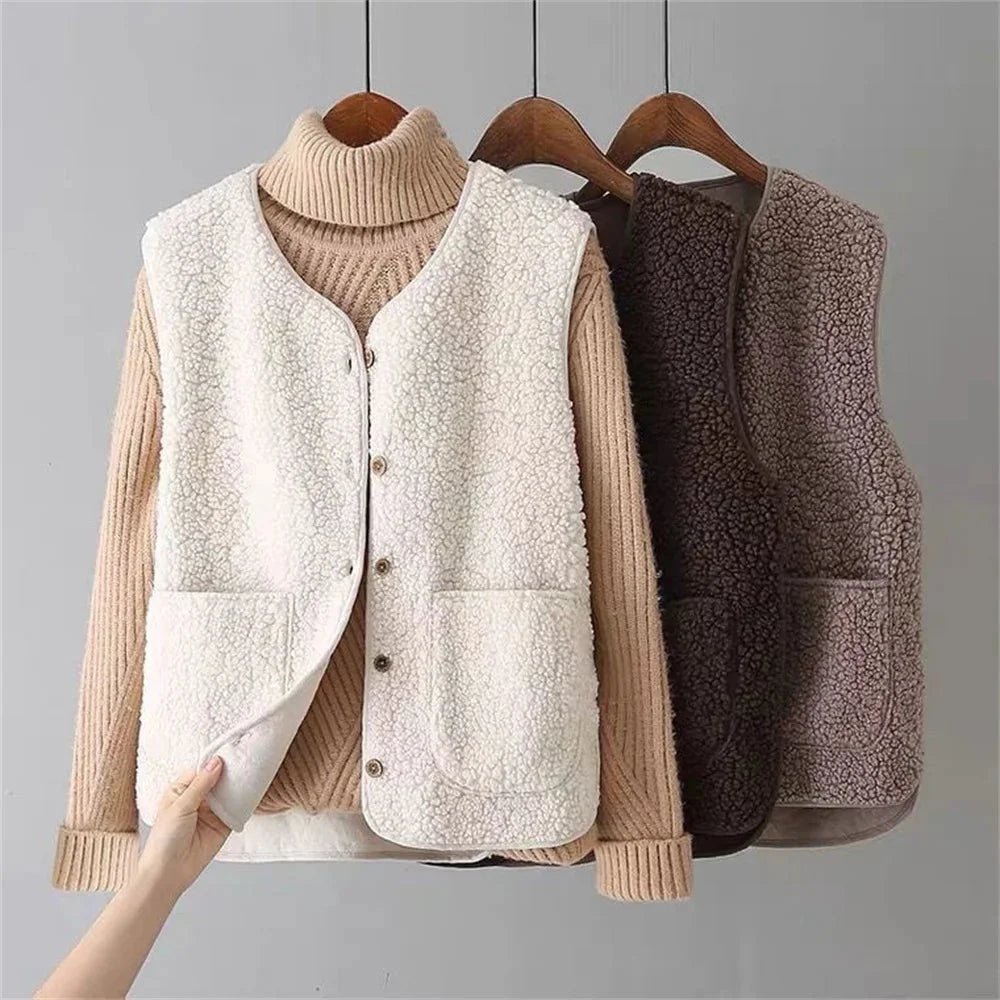 Women's cozy button-front vest with V-neck, patch pockets & soft texture for fall layering.