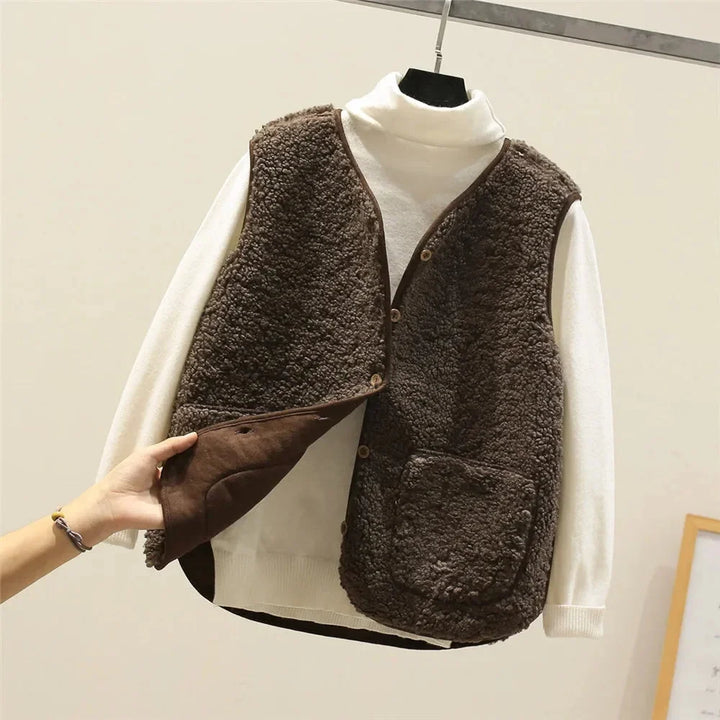 Elegant women's fall vest with a V-neck, front buttons, and stylish patch pockets for versatile looks.