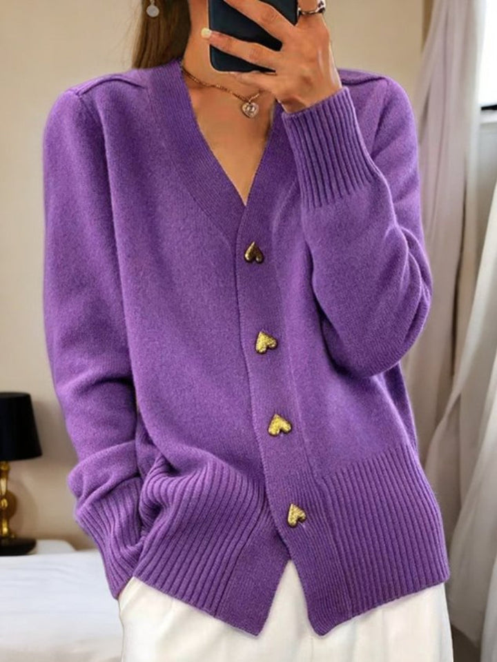 Warm women's winter cardigan with button front. Cozy knitwear, ideal for comfortable & chic cold-weather fashion.