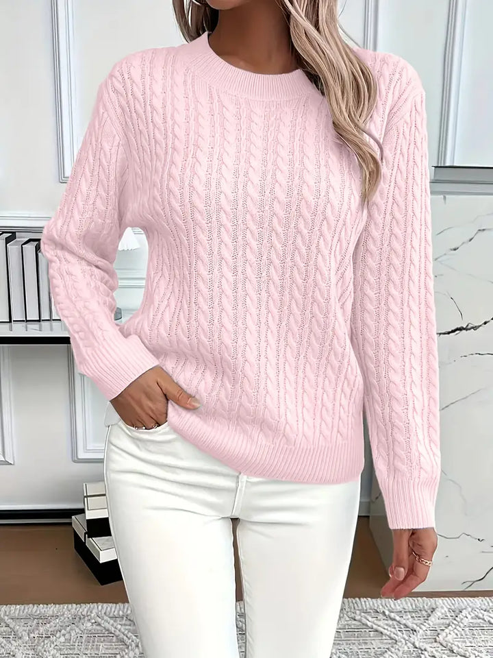 Women's cozy cable knit sweater in a relaxed fit, perfect for autumn & winter fashion, offering timeless style & warmth.