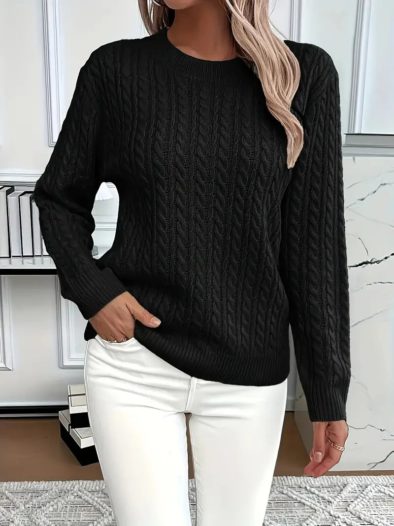 Warm women's cable knit sweater with a cozy texture, ideal for winter comfort and stylish autumn outfits.