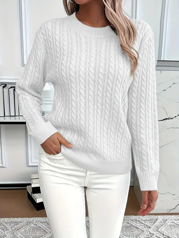 Comfortable women's relaxed fit cable knit sweater, essential knitwear for cozy autumn and stylish winter fashion.