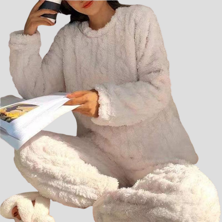 Cozy women's winter fleece pajama set. Soft fabric ensures warm, comfortable sleepwear and relaxing loungewear.