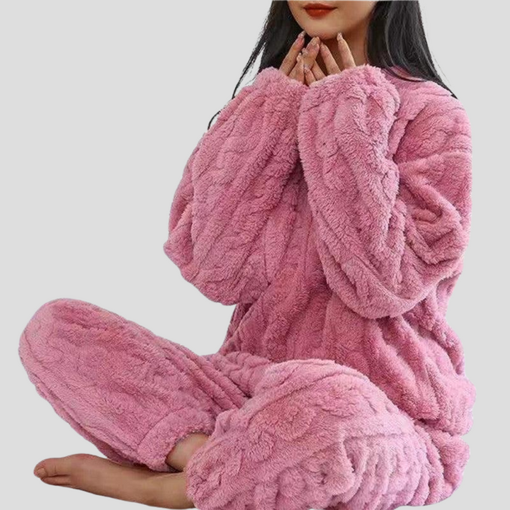 Comfortable women's fleece sleepwear set with a soft pullover top & warm pajama pants, ideal for cozy evenings.