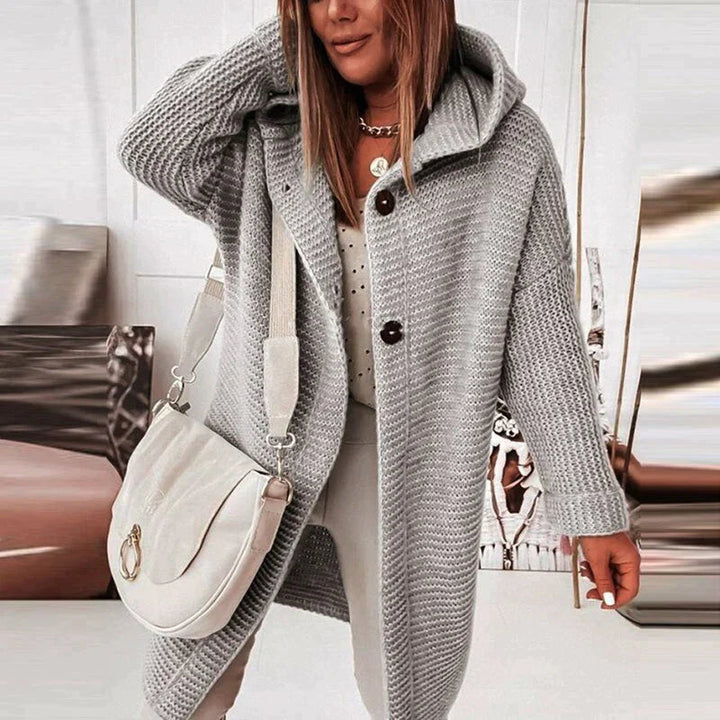 Women's cozy hooded longline cardigan sweater, perfect for fall and winter layering.
