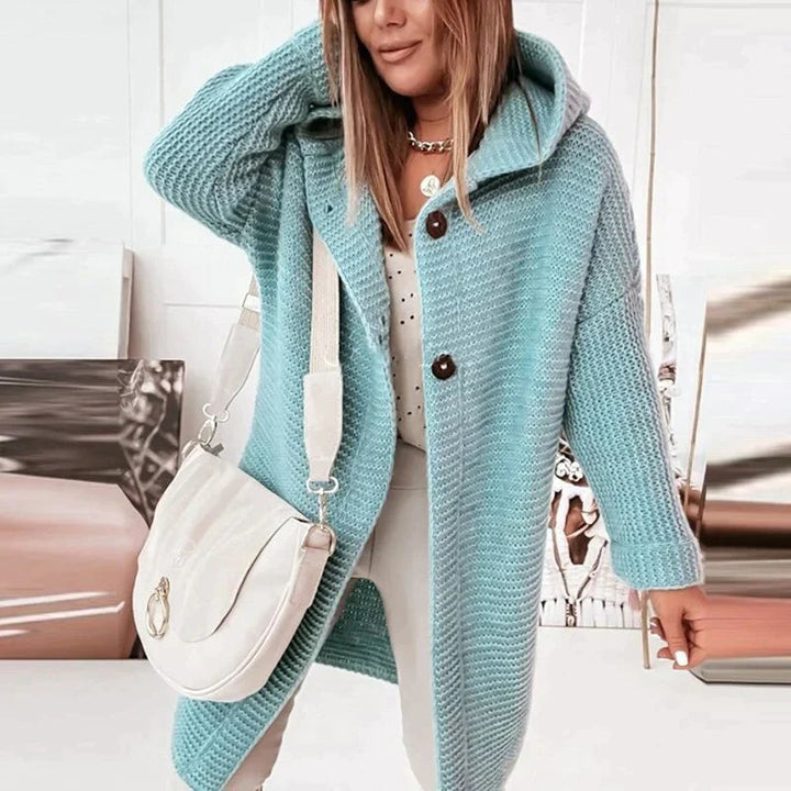 Full length view of a women's longline hooded cardigan, a cozy fall & winter essential.