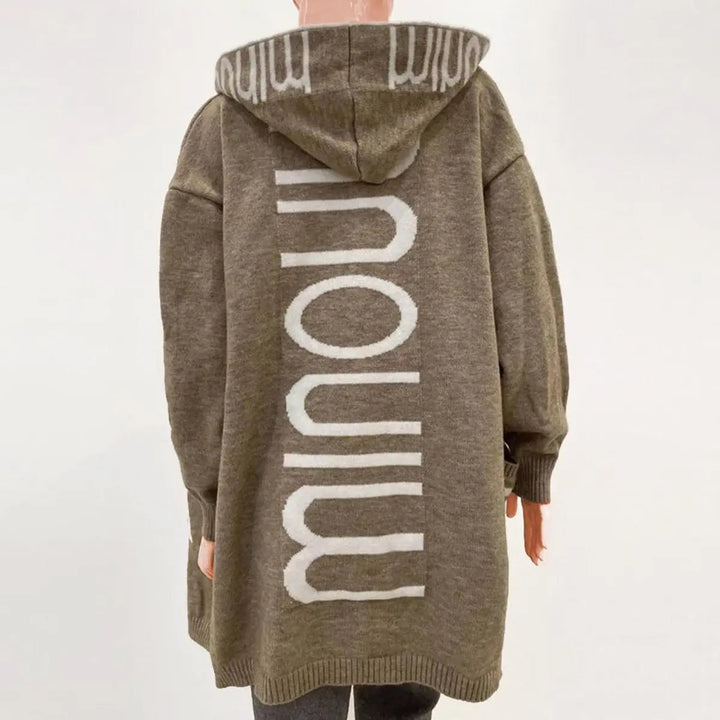 Stylish women's quilted longline hooded cardigan. Open-front knit with deep pockets for casual comfort.