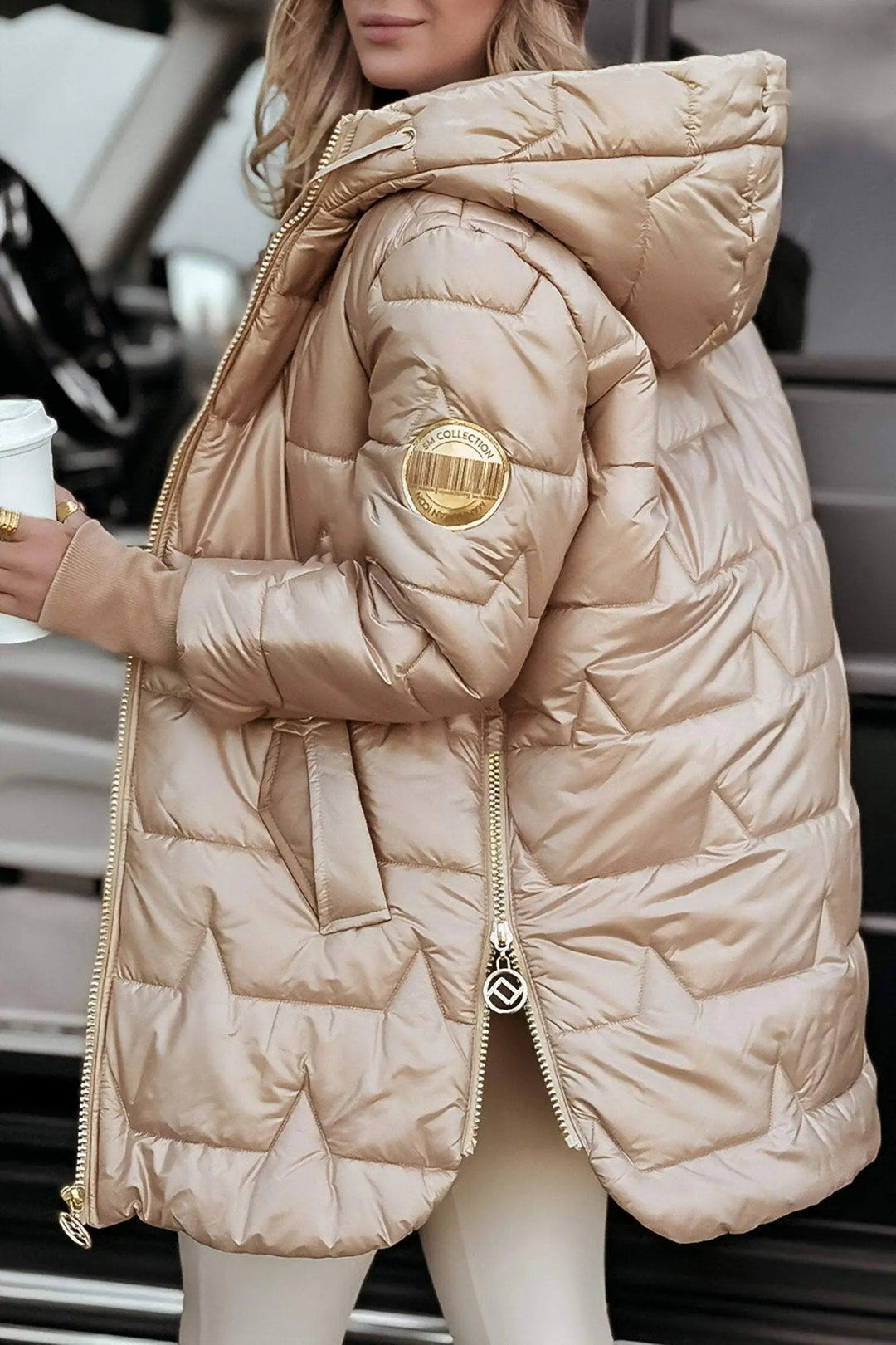 Women's hooded puffer jacket. Ideal for casual winter outerwear, offering warmth & style.