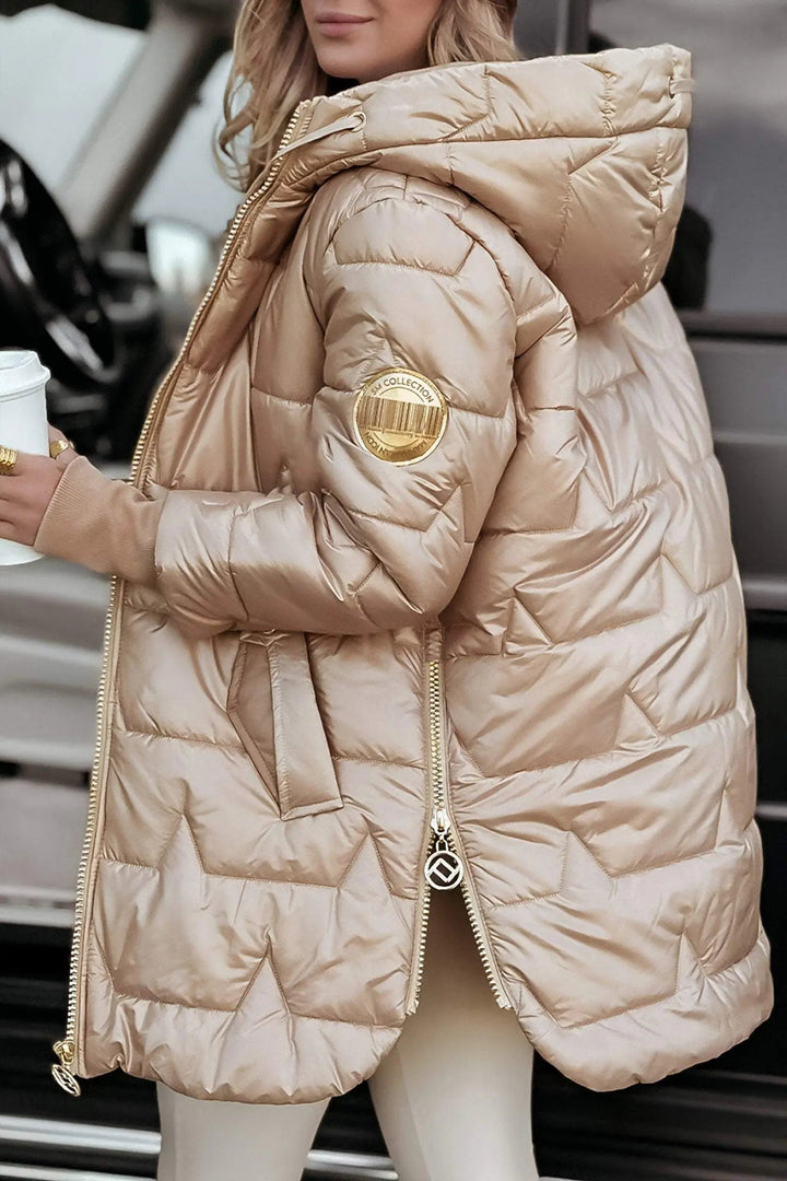 Women's hooded puffer jacket. Ideal for casual winter outerwear, offering warmth & style.