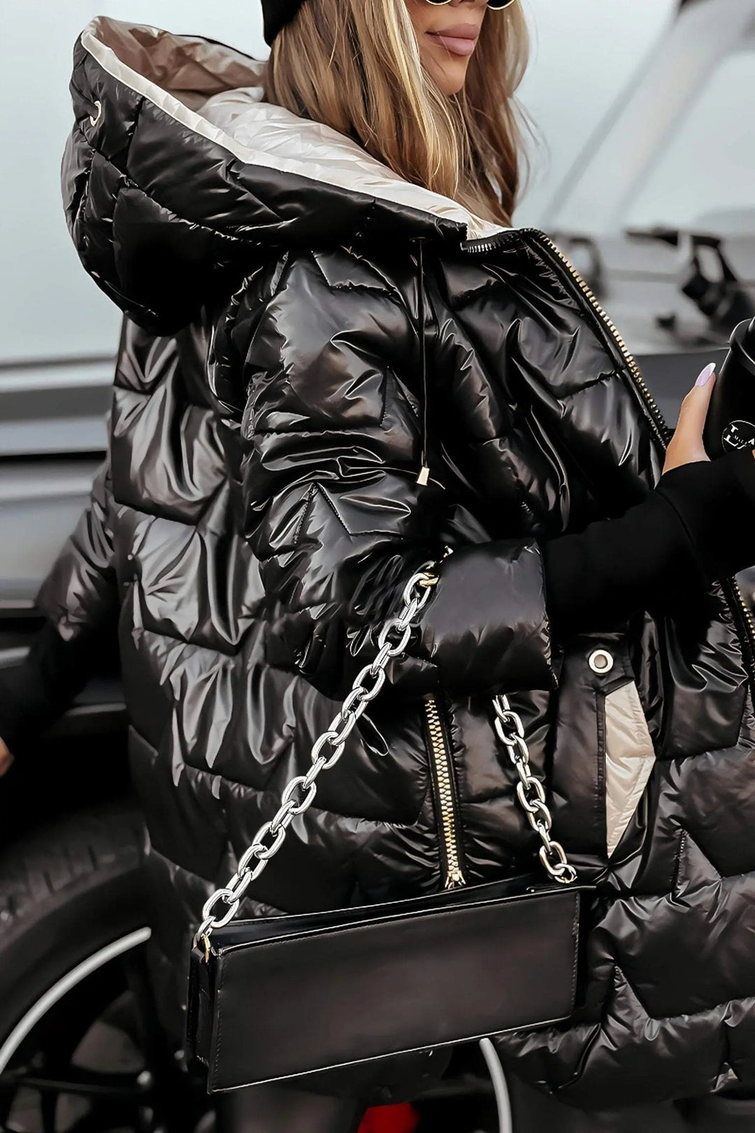 Cozy women's hooded puffer jacket, offering ultimate warmth and comfort for cold winter days.