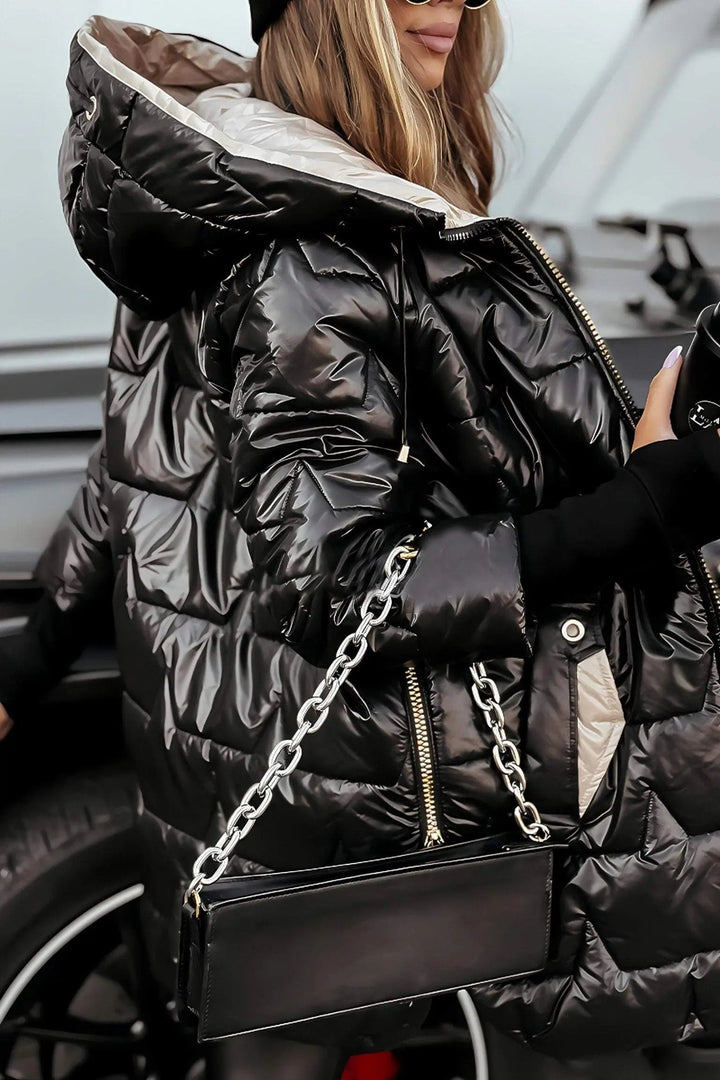 Cozy women's hooded puffer jacket, offering ultimate warmth and comfort for cold winter days.