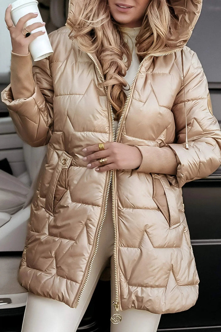 Fashionable women's hooded puffer jacket. A stylish choice for casual ladies winter outerwear.