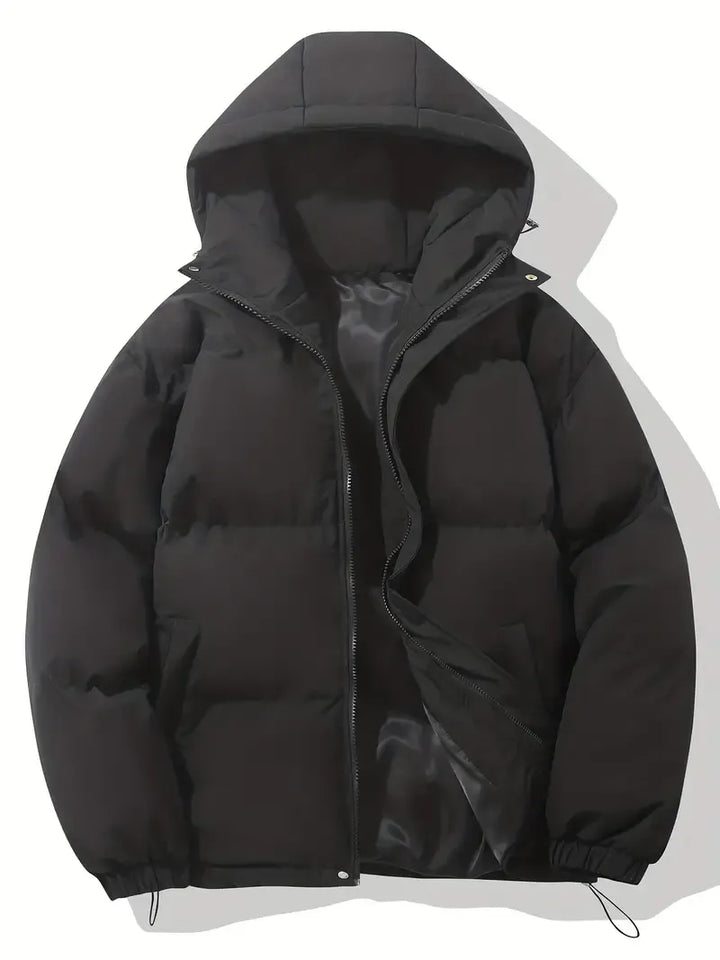 Women's cozy hooded puffer jacket in black, ideal for winter. Warm, quilted outerwear for cold weather fashion.