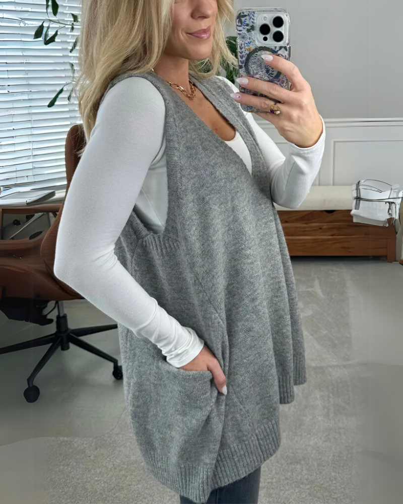 Soft knit women's vest with flattering A-line fit. Cozy, sleeveless, perfect for autumn casual wear.